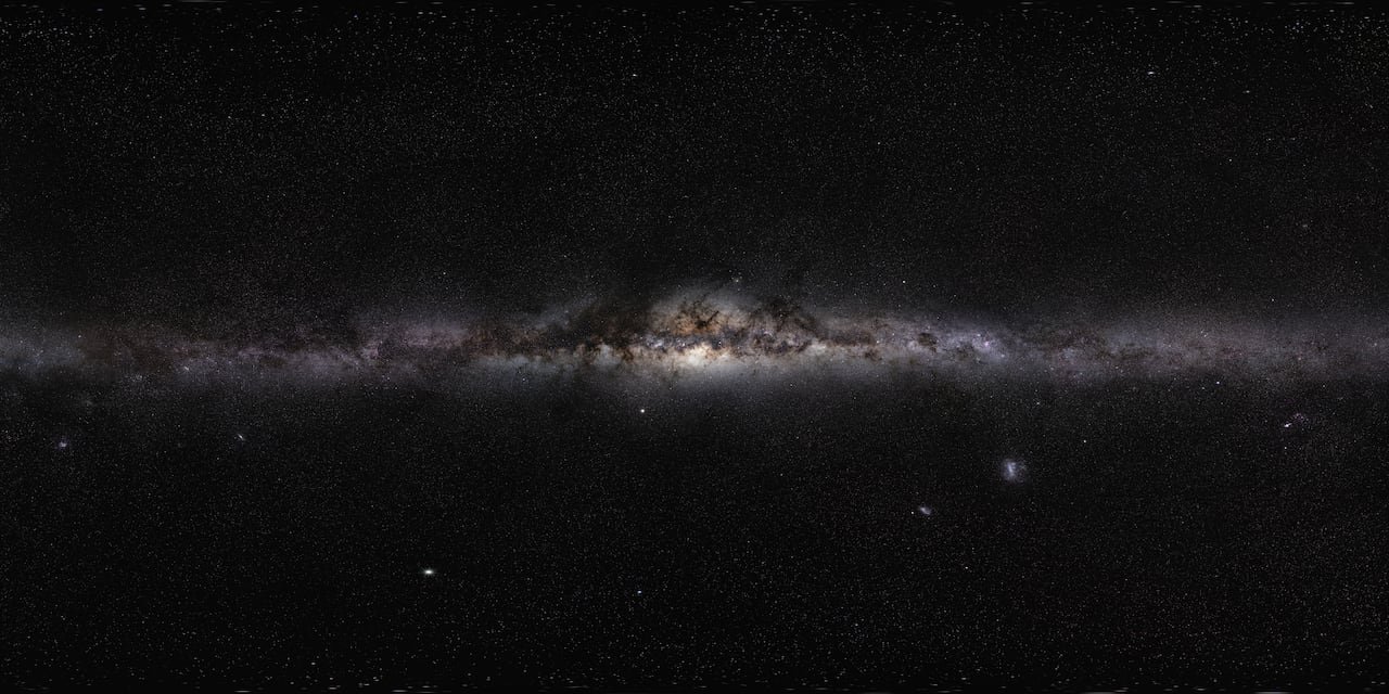 A panoramic of the Milky Way shows a large collection of stars.
